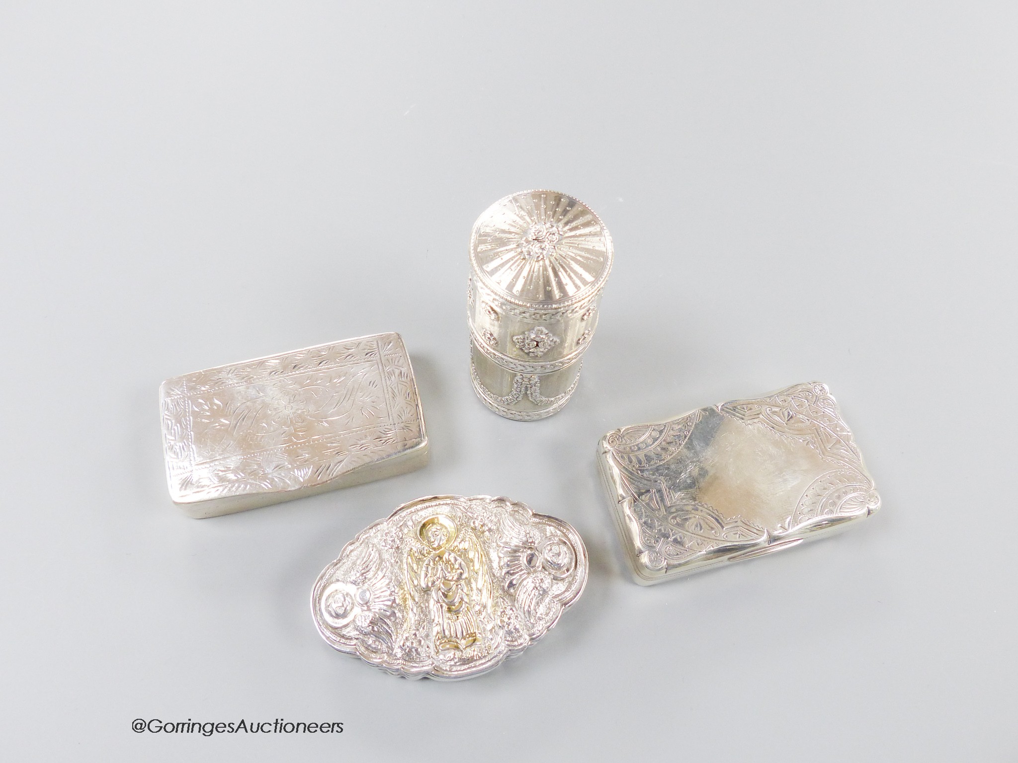 An early 20th century French white metal cylindrical box and cover, 72mm and three other continental white metal snuff boxes, including one embossed with an angel, 7.5oz.